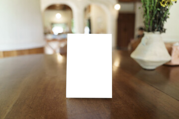 Menu mock up blank for text marketing promotion. Mock up Menu frame standing on wood table in restaurant space for text