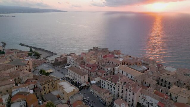 Aerial view from the drone of the beautiful village of Pizzo Calabro overlooking the Caribbean sea of Calabria in Italy. Behind it is the Salerno-Reggio Calabria motorway