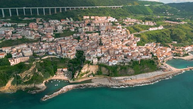 Aerial view from the drone of the beautiful village of Pizzo Calabro overlooking the Caribbean sea of Calabria in Italy. Behind it is the Salerno-Reggio Calabria motorway