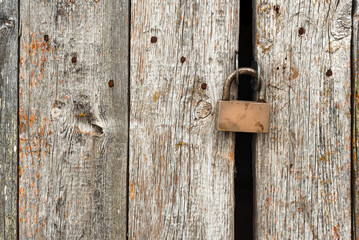 Old rusty lock on metal doors. Lock on the door with an empty place for an inscription