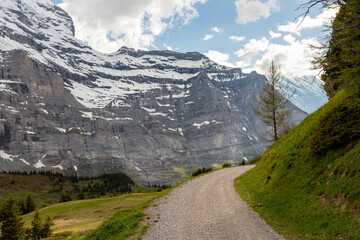 Close Up View of Snow Covered Mountain in the Swiss Alps in the Summer with Clouds in the Background in Switzerland