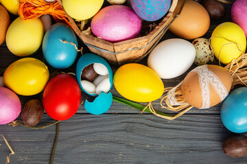 painted Easter eggs, hidden sweets in one, Happy Easter banner, background, card. 