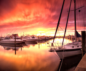Sunset at a marina, Stuart, Florida. - obrazy, fototapety, plakaty