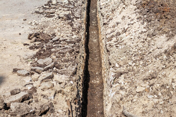 Long trench for laying water supply and sewage system pipes