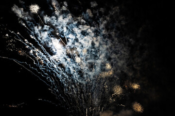 Fireworks sparkles on a black night sky