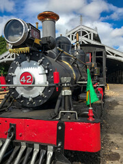 Train at the station waiting for passengers - former steam locomotive in Minas Gerais, train ride between the cities of Tiradentes and Sao Joao del Rei