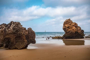 Crédence de cuisine en verre imprimé Plage de Bolonia, Tarifa, Espagne Natural beach with rocks and sailboat on the horizon of Bolonia, Cadiz, Andalucia, Spain