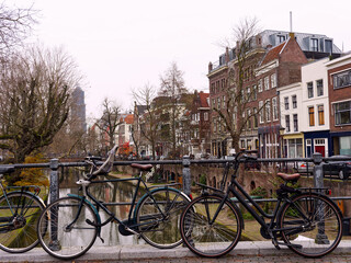 Fototapeta na wymiar City bikes on a canal bridge, Utrecht, Netherlands