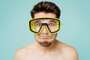 Close up young caucasian man wear shorts swimsuit scuba diving mask relax near hotel pool hold...