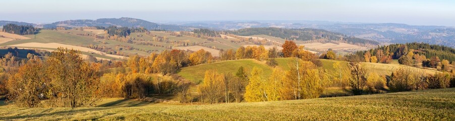 autumn panorama with meadows fields and forests