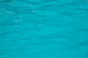 Pool water, cool blue, filling the entire frame. High resolution background or texture asset.