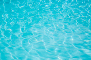 Fototapeta na wymiar Pool water, cool blue, filling the entire frame. High resolution background or texture asset.