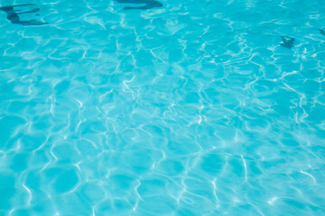 Pool water, cool blue, filling the entire frame. High resolution background or texture asset.