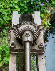 Two Interlocking Gear Wheels Detailing the Mechanical Solution for Opening a Metal River Barrier