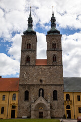 Front View of Church with Two Towers Against a Background of Blue Sky with Clouds