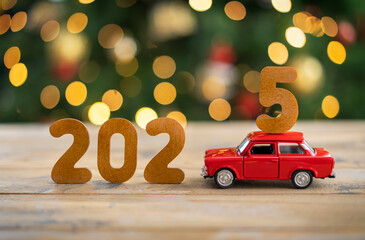 Wooden numbers 2025, toy car carries the number 5