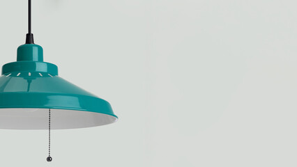 Closeup of blue pendant lamp with built-in LED light source, isolated on grey copy-space background.