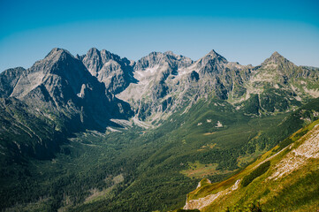 View of the High Tatras from the Belianske Tatras, showcasing the majesty of the Slovakian mountains under a pristine blue sky