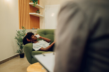 A sad african american woman is having a mental break down.