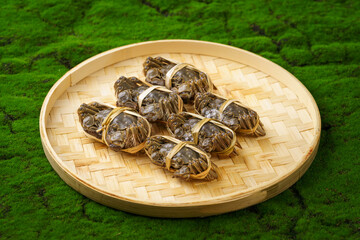 Fresh live crab against a monochromatic background