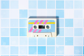 Music cassette with pop pastel colors from the 1980s.