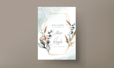 Elegant wedding invitation card with bohemian leaves watercolor