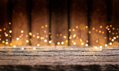 Empty wooden table with defocused bokeh lights in the background