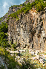 Bathing beach in the beautiful turquoise river of Valbona Valley, Theth National Park, Albanian Alps, Albania