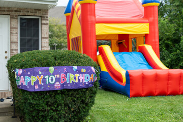 Fototapeta na wymiar Birthday Party in the backyard, trampoline 