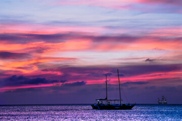 Aruban red sunset with boats