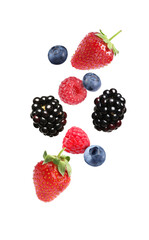 Blackberries, blueberries, strawberries and raspberries falling on white background