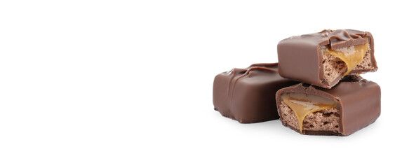 Tasty chocolate bars with caramel on white background, space for text
