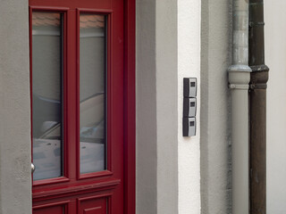Obraz premium Key boxes next to a building entrance door. The keys are locked for tourists who booked an apartment to make holiday. Self service to open the door without the host.
