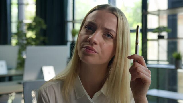 Portrait pensive doubtful tired Caucasian girl businesswoman female employer office worker young woman manager hold pen think business idea consider difficult question looking doubt unsure solve issue