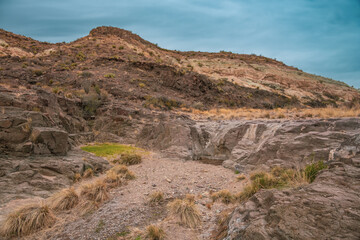 Grass Grows Below Dry Falls In Smoky Creek In Big Bend