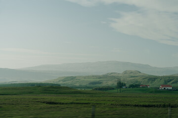 Scenic view of green landscape against sky at Iceland