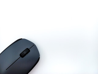 Black and Grey Wireless Computer Mouse Isolated On White Background. Corner Position With Negative Space