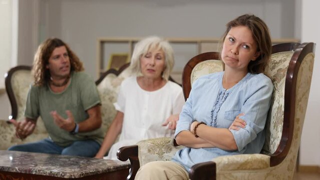 Domestic quarrel relatives in the apartment. Adult offended woman turned away. High quality 4k footage