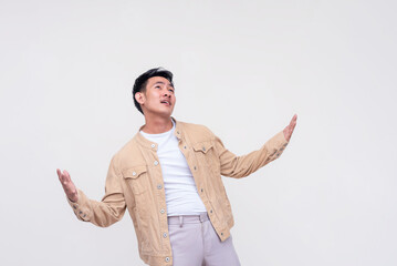 An overzealous young man looking up and proclaiming his love. Isolated on a white background.
