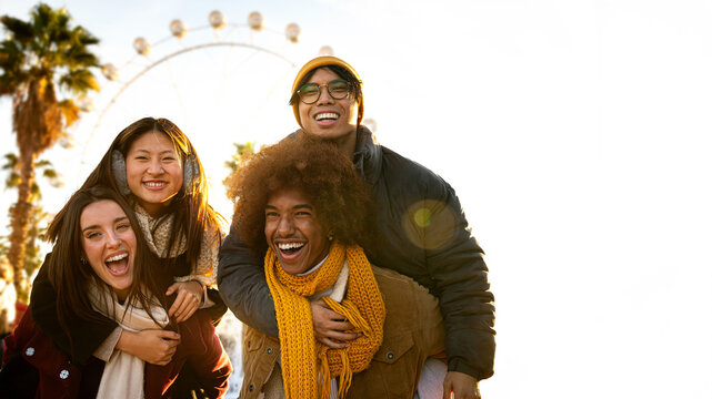 Group of diverse, multi-ethnic cheerful happy friends smiling at camera having fun outdoors.Piggy back ride.Copy space.