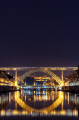 Porto, Portugal - Night cityscape of Dom Luis bridge in Oporto old town.