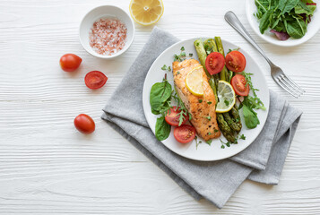 Baked Delicious salmon, green asparagus on  plate