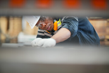 Industrial factory employee working in wooden manufacturing industry