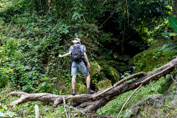 Smiling young people enjoying hiking at nature and talking outdoor. young people Hiking On Mountain And Enjoys Nature.