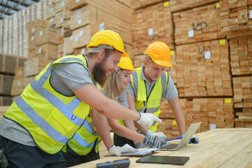 Warehouse worker working at lumber yard in Large Warehouse. Worker are  Inventory check at Storage shelves in lumberyard.