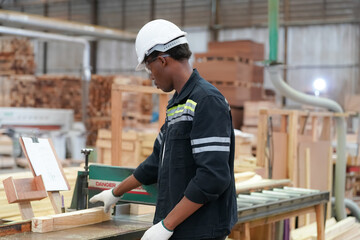 Industrial factory employee working in wooden manufacturing industry