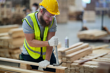 Industrial factory employee working in wooden manufacturing industry