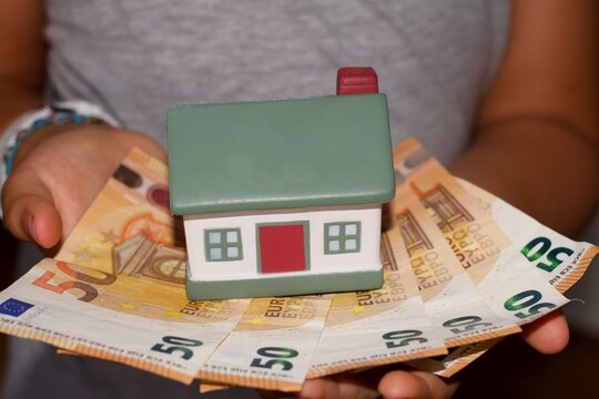 Model house with euro banknotes