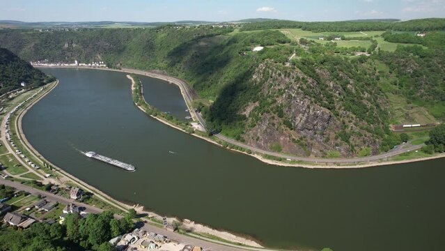 The striking slate rock Loreley near Sankt Goarshausen and the Rhine from the air, world heritage Upper Middle Rhine Valley, Rhineland-Palatinate, Germany | Aerial view of the steep slate rock