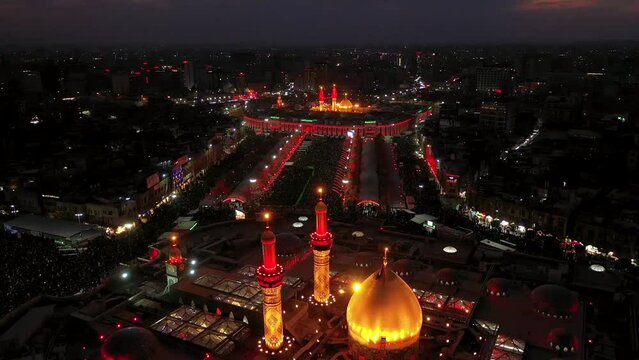 A night shot by a drone of Shiite visitors and pilgrims at the mosque and shrine of Imam Hussein and Abbas in Karbala, Iraq.